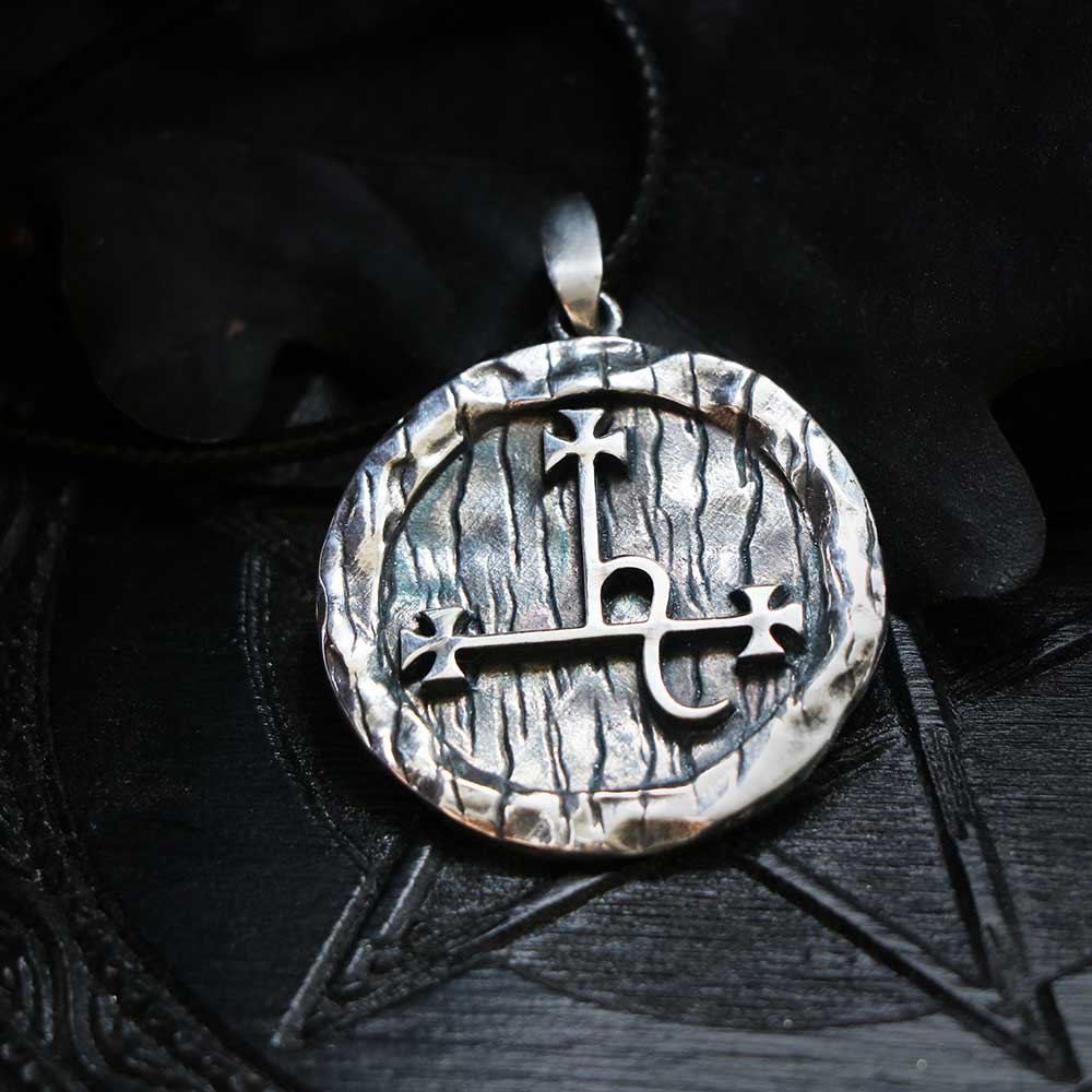 Silver Lilith sigil pendant on black fabric
