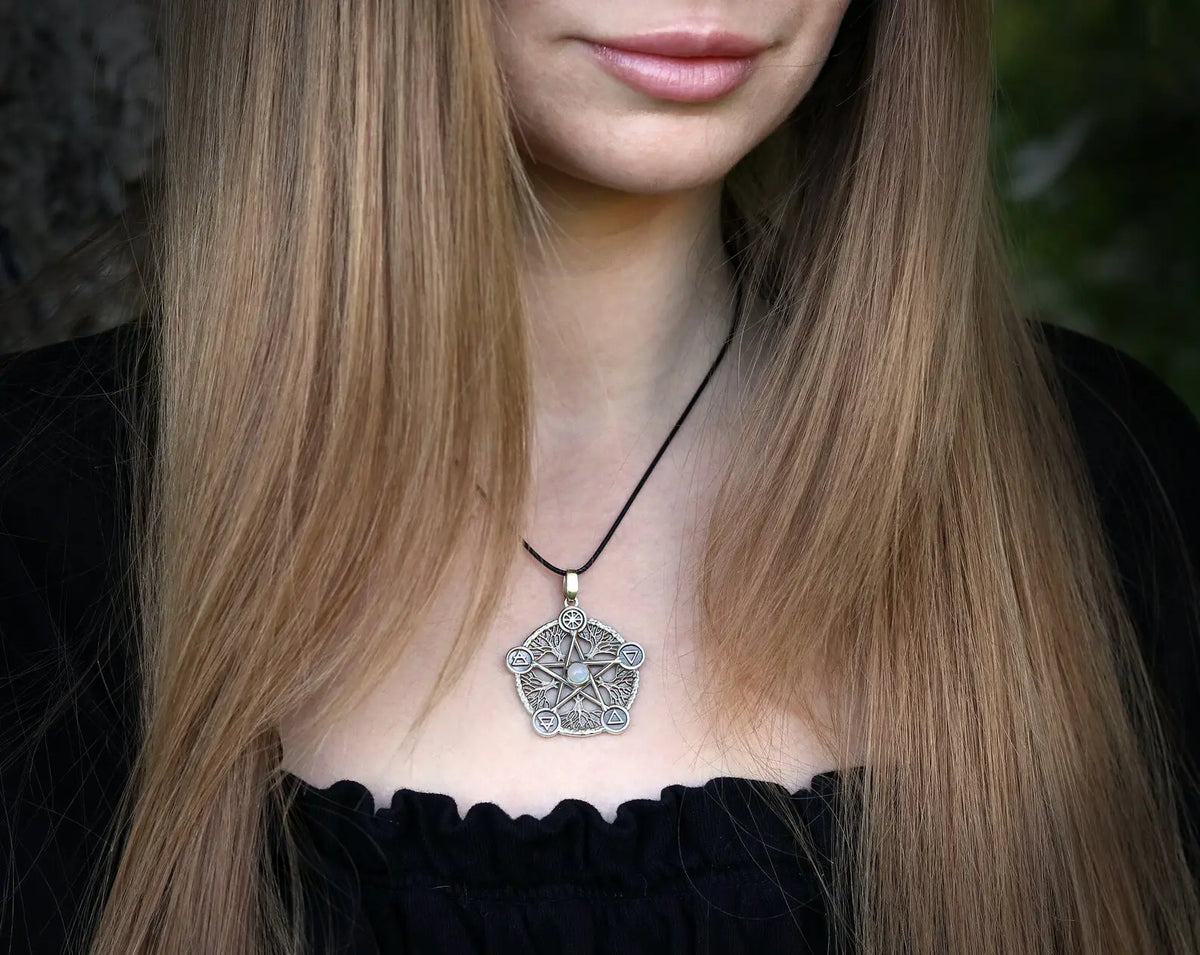 Model wearing a pentacle necklace, highlighting the intricate pentagram design.