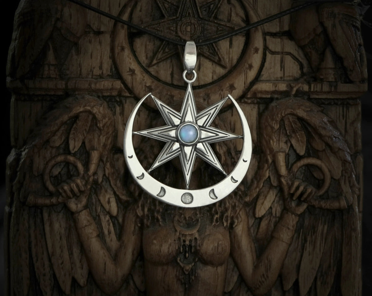 Silver star of Ishtar with a moonstone pendant with on a dark background