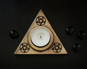 wooden candle holder with inverted pentagrams