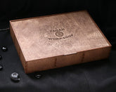 May include: A wooden box with a lid, featuring a laser-engraved logo that reads "Pagan Workshop". The logo is a triangle with a crescent moon, sun, and eye inside.
