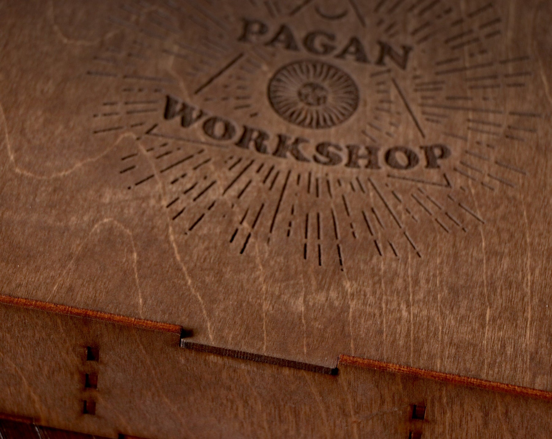 May include: A wooden box with a laser-engraved logo that says "Pagan Workshop" with a sunburst design.