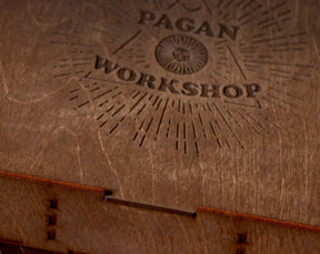 May include: A wooden box with a laser-engraved logo that says "Pagan Workshop" with a sunburst design.