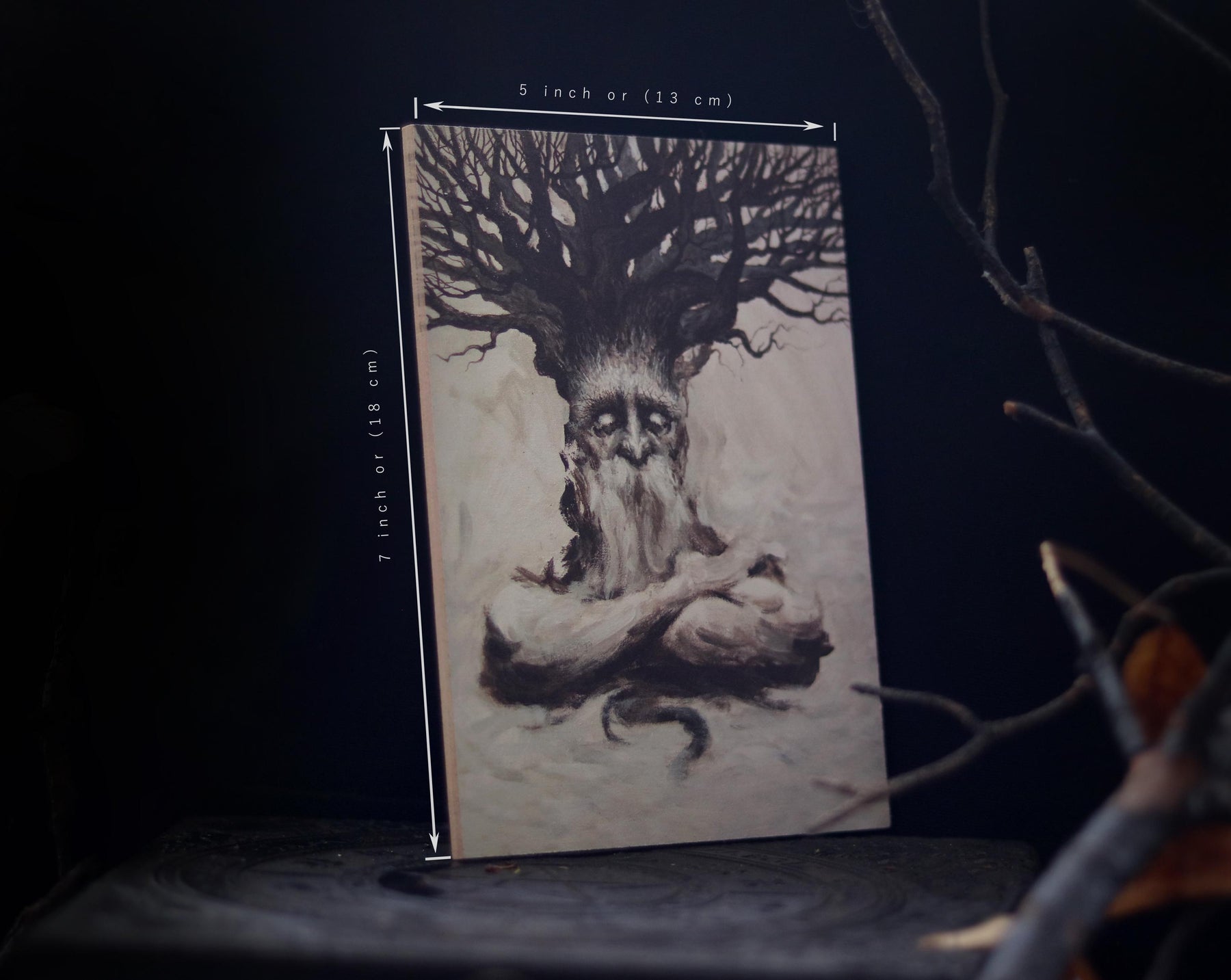 May include: A black and white illustration of a tree spirit with a beard and a large tree growing from its head. The illustration is on a white background and is framed in a wooden frame. The frame is 7 inches by 5 inches.