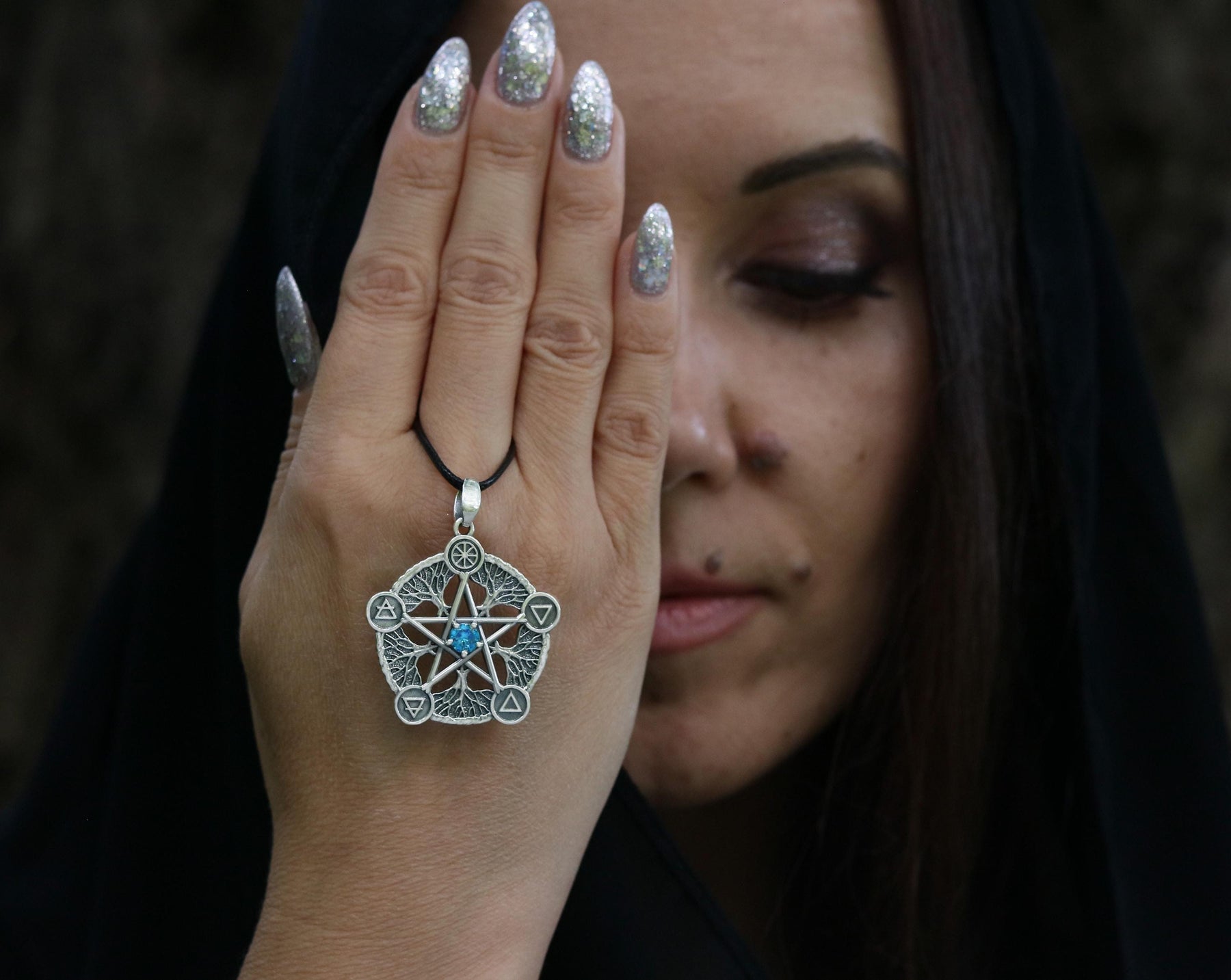 silver pentagram necklace with blue cubic zirconia