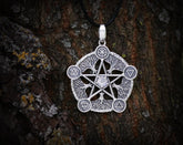 May include: Silver pendant necklace featuring a five-pointed star with a clear crystal in the center. The star is surrounded by five tree branches with symbols representing the elements: earth, air, fire, water, and spirit.