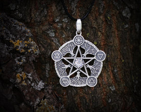 May include: Silver pendant necklace featuring a five-pointed star with a clear crystal in the center. The star is surrounded by five tree branches with symbols representing the elements: earth, air, fire, water, and spirit.