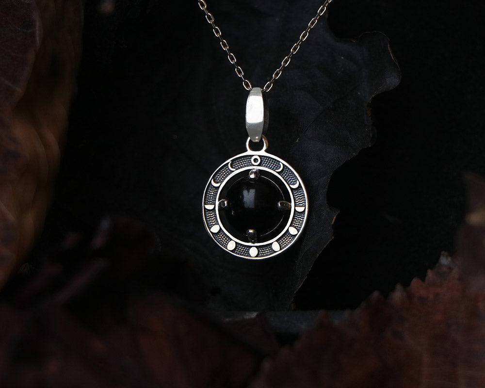 moon phases pendant made of Sterling Silver with black obsidian